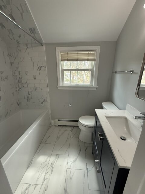 Bathroom Remodel in Stamford, CT: Tub Under a Sloped Ceiling by Gerety Building & Remodeling, photo 1